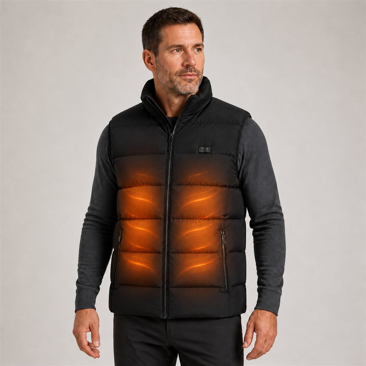 Model wearing the black quilted heated vest with an illustrative warm heating effect