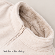 Close-up of the fleece exterior, soft collar lining and cream zipper